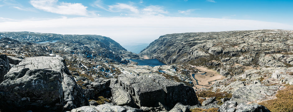 Panorama of the Landscape at the Torre mountain, Serra da Estrela, Portugal, on a cold day against blue sky