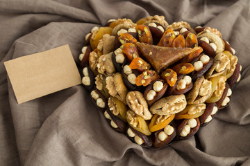 the special dried fruits and nuts plate concept for store seller. dried apricot,fig ,hazelnut, nut,special Turkish east food.