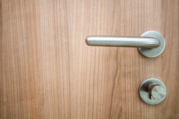 handle door knob on wooden door .