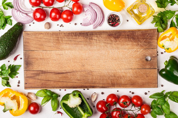 Fresh Organic Vegetables and cutting board with place for text. Healthy food or diet concept