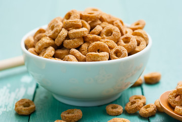 breakfast cereal with milk, honey on blue wood table