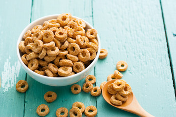 breakfast cereal with milk, honey on blue wood table
