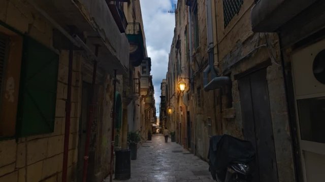 Time lapse view of a typical narrow lane in Valletta (Malta) before sunset