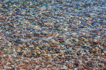 seamless background wet stones beach  surface near water 