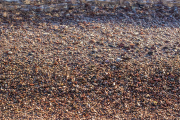 seamless background wet stones beach  surface near water 