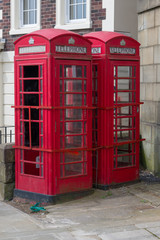Obraz na płótnie Canvas Two Red Telephone Boxes