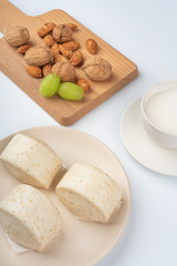 Dried fruit and milk bread on a white background