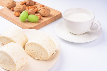 Dried fruit and milk bread on a white background