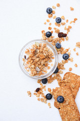 Crispy muesli cookies and blueberry Breakfast cereals isolated on white background, selective focus, top view