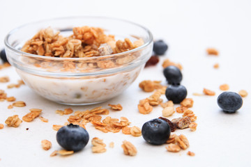 Crunchy muesli and blueberry Breakfast cereals isolated on white background, selective focus, top view