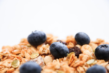 Crunchy muesli and blueberry Breakfast cereals isolated on white background, selective focus, top view