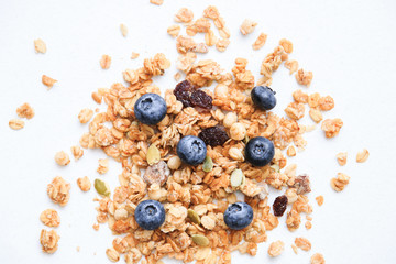 Crunchy muesli and blueberry Breakfast cereals isolated on white background, selective focus, top view