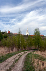 Naklejka na ściany i meble the road under the hill leads to the monastery walls