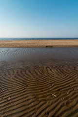 Dessert like textured sand - Baltic sea gulf beach with white sand in the sunset