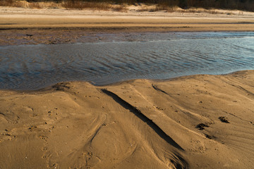 Dessert like textured sand - Baltic sea gulf beach with white sand in the sunset