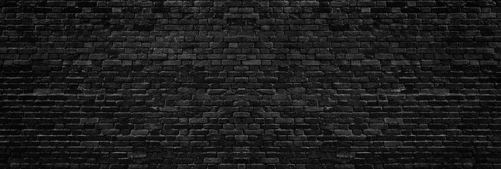 Black rough brick wall wide texture. Dark brickwork panoramic background