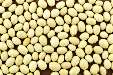 Soybean beans close-up on brown background. Source of protein, vegetarian.