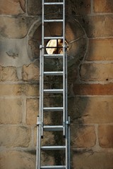 old metallic ladder on the wall in the street