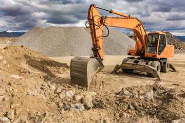 Excavator in a stone extraction mine to transform into a gravel
