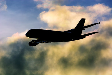 Airbus A380, Airplane shape sunset  shortly after departure in colorful clouds