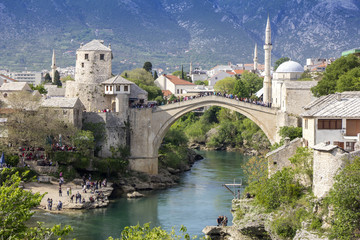 Fototapeta na wymiar Mostar with the Old Bridge houses and minarets in Bosnia and Herzegovina
