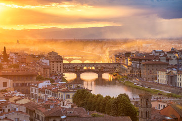Beautiful sunset landscape view of Ponte Vecchio bridge in Florence, Italy. Europe