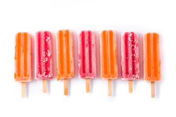 Orange and strawberry popsicles isolated on white background.. Top view
