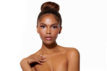 Beautiful portrait of a young woman African American with perfect skin and a gentle makeup in pink...