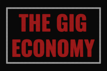 The Gig economy word on dark screen