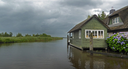Fototapeta na wymiar Gieterhoorn watervillage Overijssel Netherlands boathouse