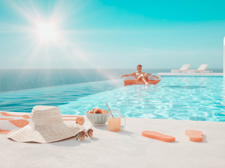3D-Illustration. modern luxury infinity pool with summer accessoires