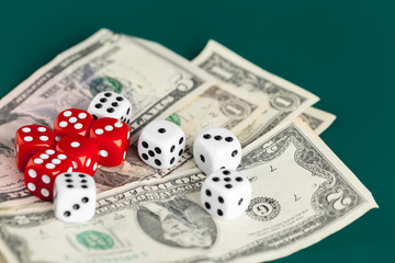 Playing Dices and Stack of American Dollars Bills.