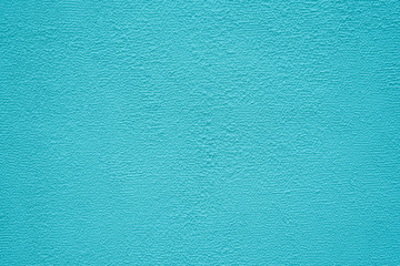 Fototapeta premium Bright turquoise stucco texture. Background.
