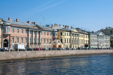 Fototapeta na wymiar houses built in the 18th century on the embankment of the Fontanka river. Saint-Petersburg