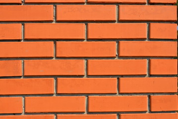 Red orange building bricks, brick wall, building wallpaper on the sun.