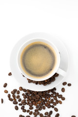 cup of coffee with sprinkling of coffee beans