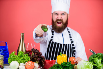 Chef man in hat. Secret taste recipe. Bearded man cook in kitchen, culinary. Vegetarian. Mature chef with beard. Dieting and organic food, vitamin. Healthy food cooking. Do not like it