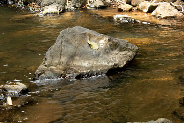 stone in waterfall