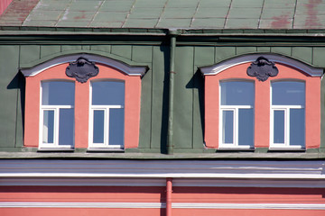 Attic Windows of a house built in the 19th century on the embankment of the Fontanka river....