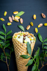 Fresh pistachios ice cream on the rustic background. Selective focus. Shallow depth of field.