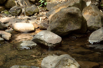 stone in waterfall