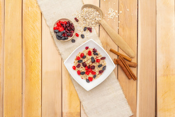 Healthy vegetarian (vegan) breakfast with oatmeal and fruits.