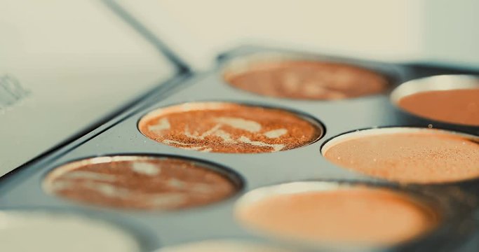 Close up cosmetic , makeup , blush on and colorful glamour glitter eyeshadow using , 4k dci resolution