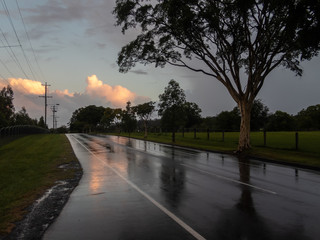 Wet Road with Reflection and Evening Cloud