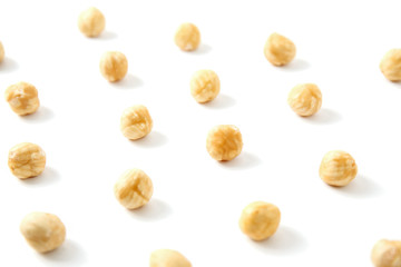 Nuts pattern - hazelnut on white background.