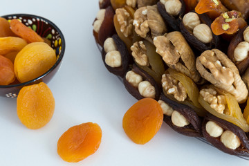 the special dried fruits and nuts plate concept for store seller. dried apricot,fig ,hazelnut, nut,special Turkish east food.