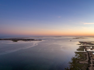 Fototapeta premium Algarve sunset seascape at Ria Formosa wetlands reserve, southern Portugal.