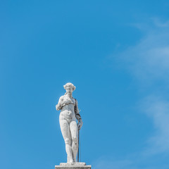 Statue as roof decoration of Doge's Palace in Venice, Italy