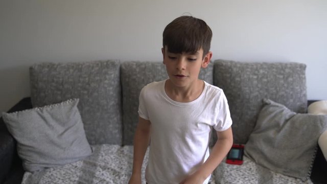 Little boy dancing at home
