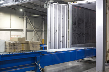 Automated warehouse. Boxes moving on conveyer